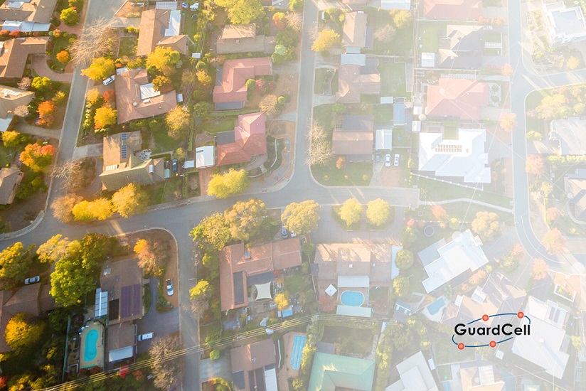 Aerial view of a suburban neighbourhood of homes protected by security companies